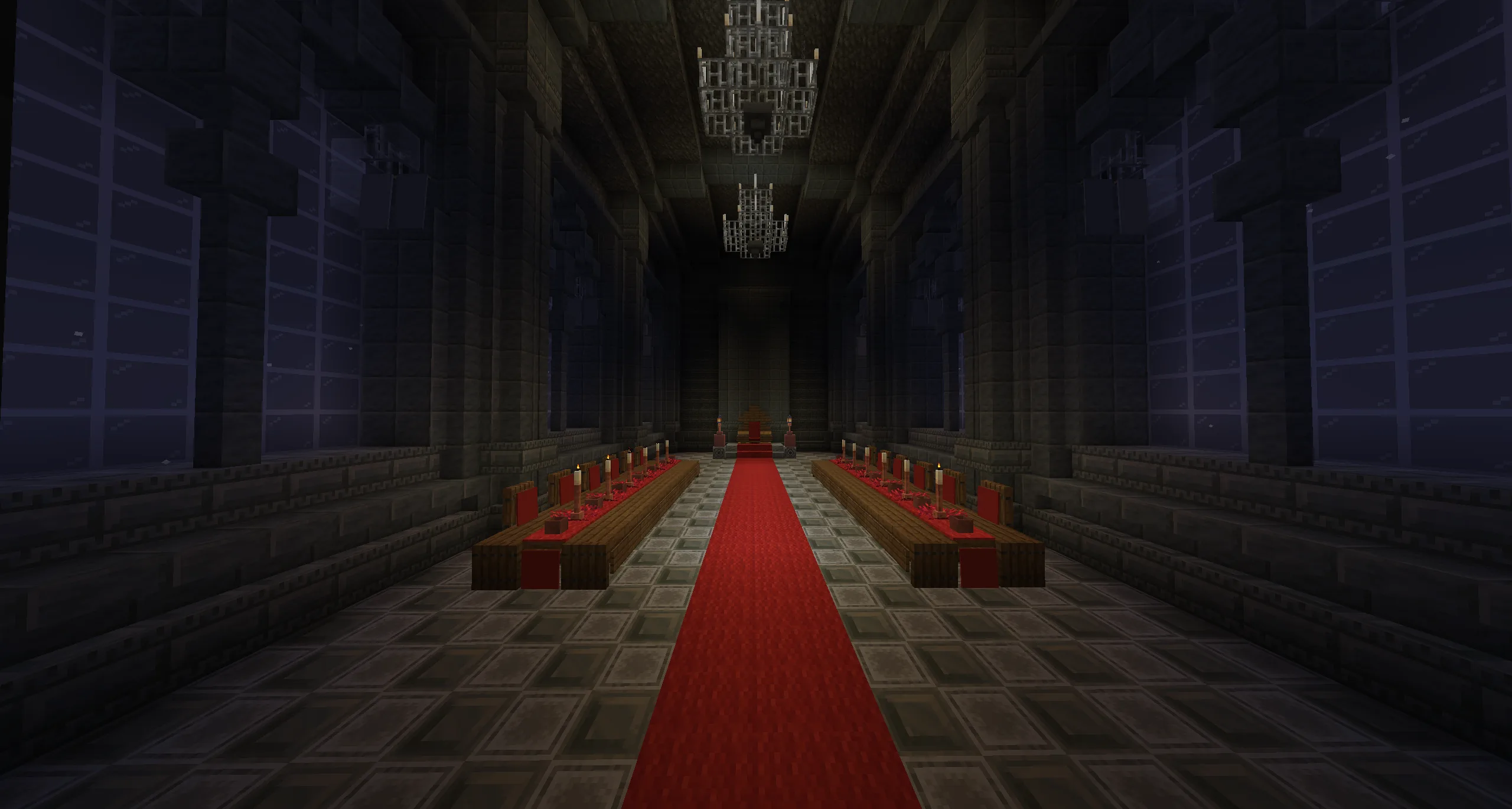 A candlelit throne room in Old King, with a red carpet leading between long tables